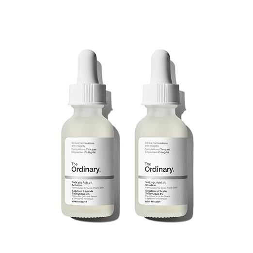 Two bottles of The Ordinary Salicylic Acid 2% Solution, each with a white dropper cap, labeled as a treatment for blemish-prone skin.